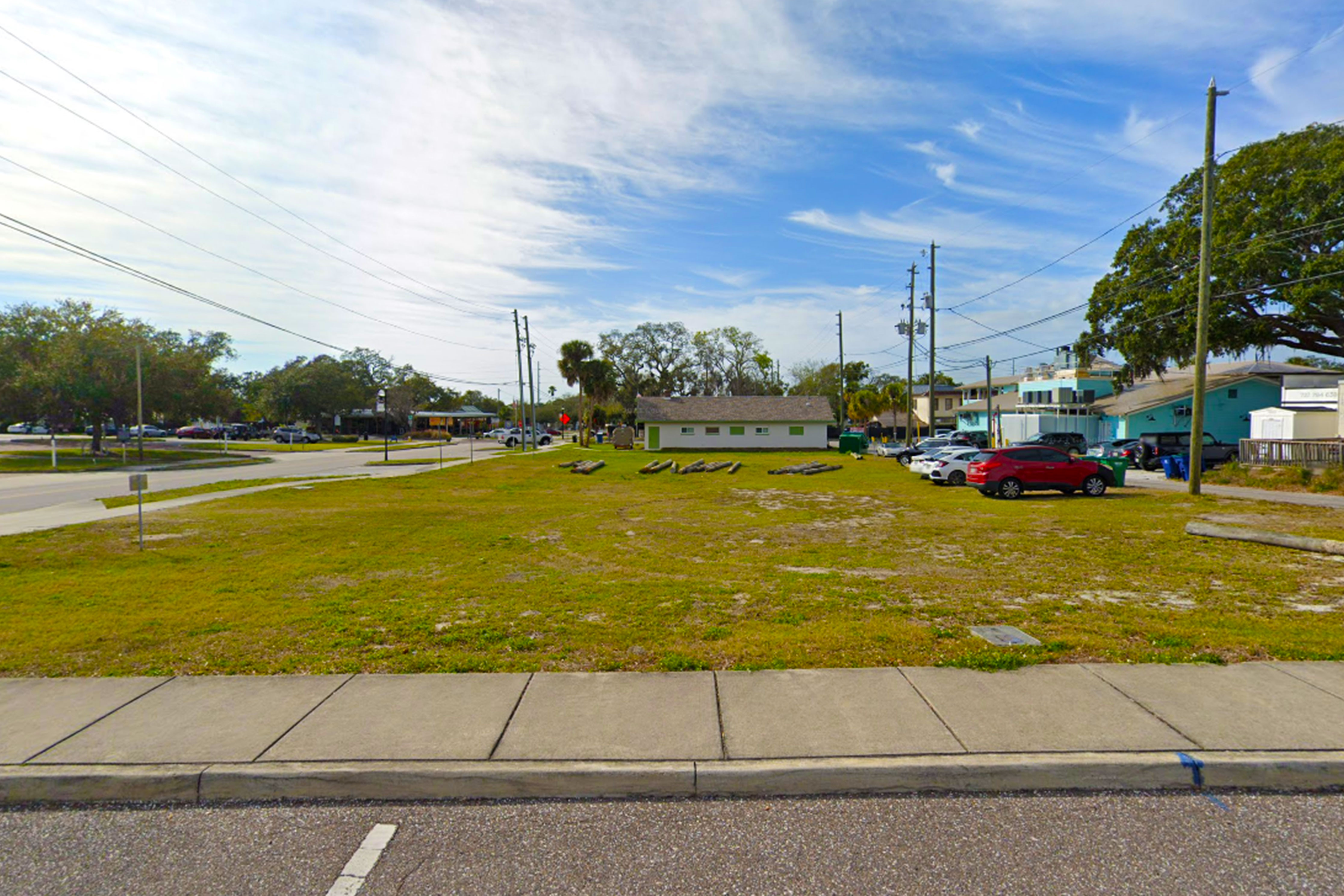 This image is an exterior photograph of a vacant commercial lot located on Georgia Avenue, Palm Harbor Florida